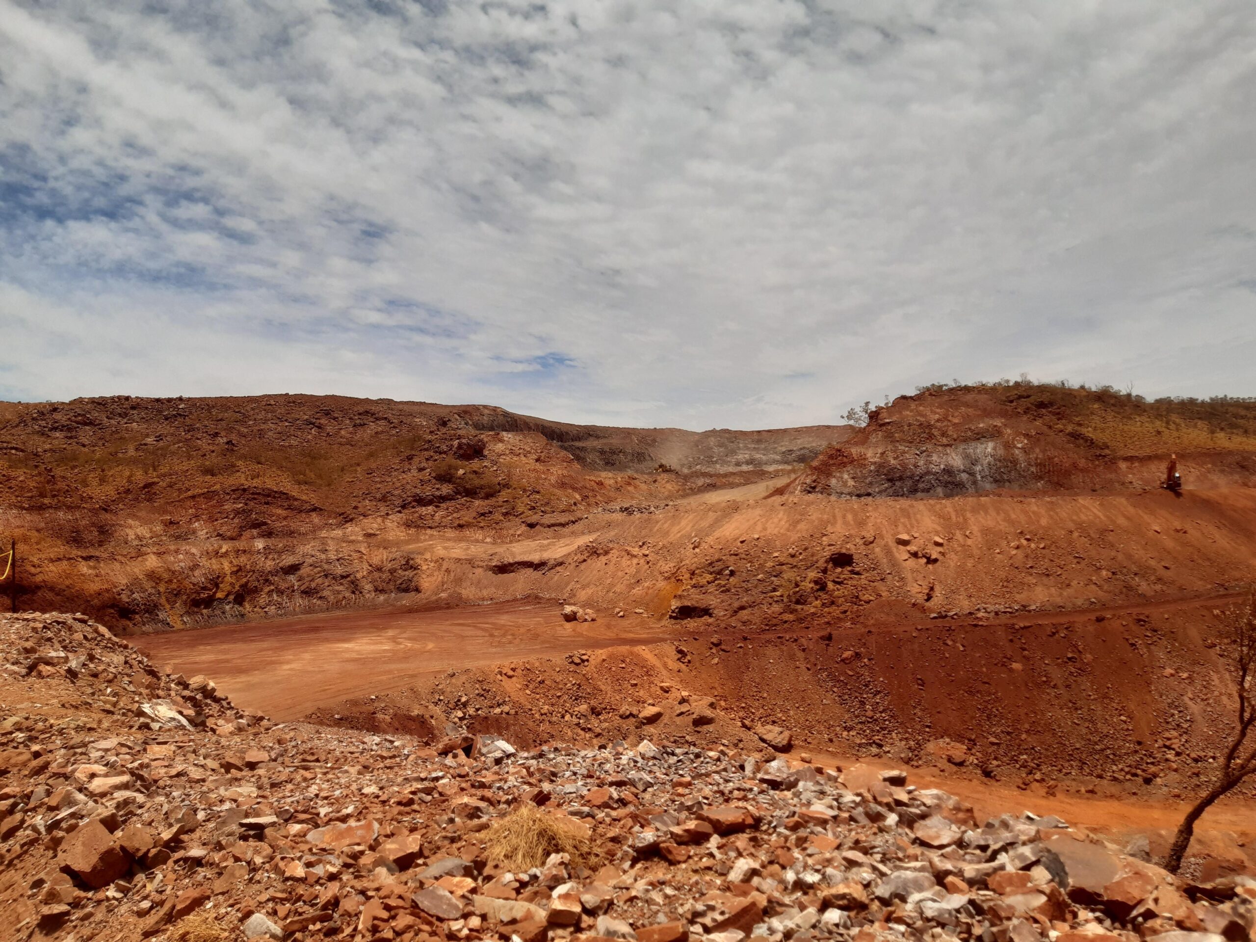 Site of Iron Bridge mine, red dirt under blue sky